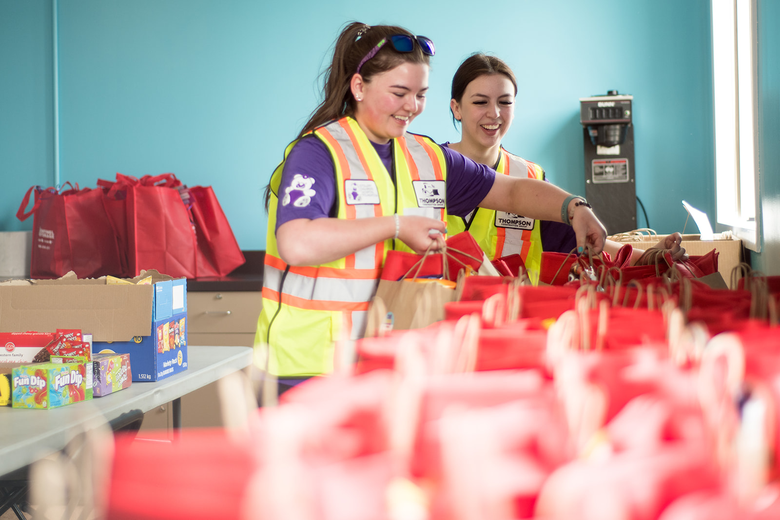 stolllery volunteers preparing gift bags at cub cinema event