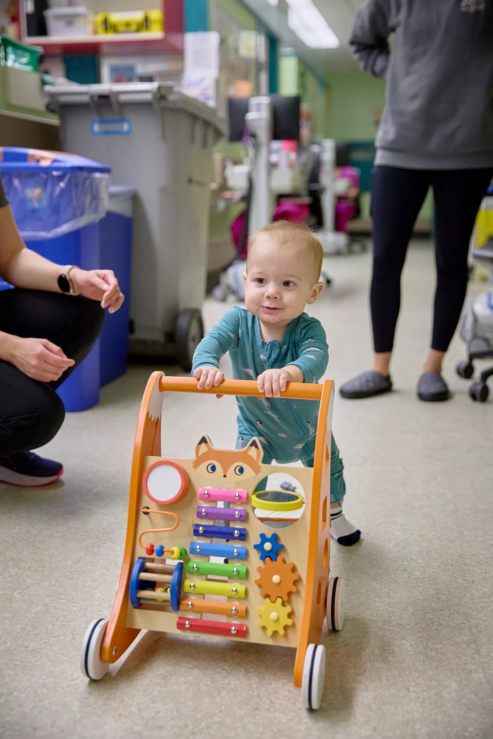 baby Stollery patient plays with colourful push-toy
